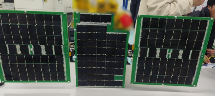 Three solar-array panels with green frames displayed side by side.