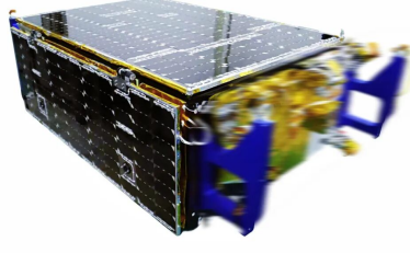 Compact box-shaped spacecraft assembly with solar-cell surfaces and gold thermal covering.