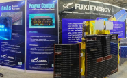 Fuxi Energy booth displaying a satellite model and solar-array panels.