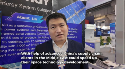 Interview scene in front of the Fuxi Energy space-power exhibition display.